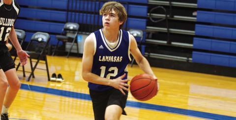Jax Pratus drives the baseline to finish at the rim in the first spring game of the year for Lampasas. HUNTER KING | DISPATCH RECORD