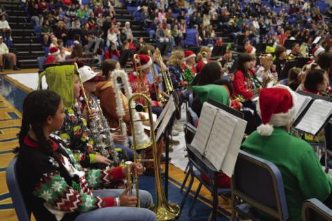 Lampasas Middle School Beginner Band members in festive Christmas attire wait their turn to perform. ERICK MITCHELL| DISPATCH RECORD