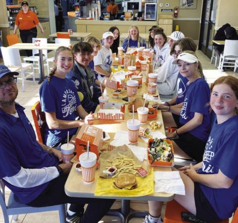 COURTESY PHOTO | KENNETH PEISER The Lampasas tennis team enjoys a meal at Whataburger after a successful trip to Burnet.