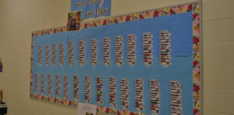Taylor Creek Elementary School staff measure student reading achievements by class with a decorative chart. ERICKMITCHELL | DISPATCH RECORD
