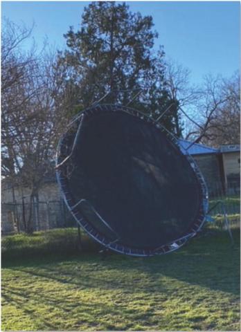 Trampolines were the big losers in the battle against gusty winds on Monday. Olivia Moreno sent this photo of a trampoline turned upside down and smashed up against the fence. COURTESY PHOTO