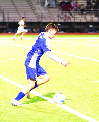HUNTER KING | DISPATCH RECORD Kent Ashley dribbles through the midfield during last Friday’s match against Stephenville.