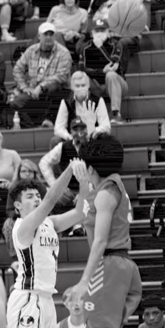 Anthony Ortiz, left, makes one of the seven three-pointers that Lampasas had in the first quarter on Wednesday. JEFF LOWE | DISPATCH RECORD