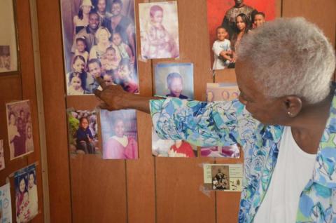Clementine Walker looks over family photos in her home on Third Street. She retired last month after caring for patients for 56 years at Lampasas Nursing &amp; Rehabilitation. MONIQUE BRAND | DISPATCH RECORD