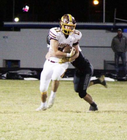 D.J. Smart attempts to break the tackle attempt of a Water Valley defender during the final game of the season. JESSICA MALDONADO | DISPATCH RECORD