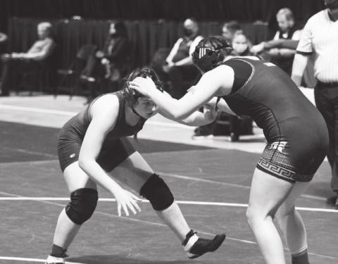 Mia Martell, left, wrestles last week against Burleson Centennial. FILE PHOTO