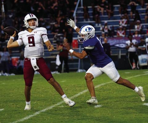 Elias Ayala chases the Chaparral quarterback during last Friday’s game. HUNTER KING | DISPATCH RECORD
