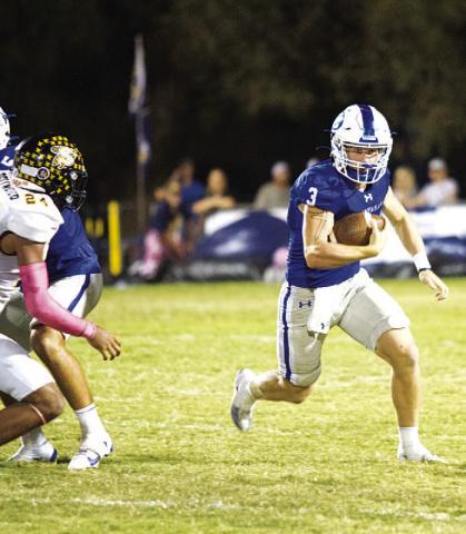 Reed Jerome runs away from a Stephenville defender during last Friday’s district contest. The quarterback continues to lead the Badgers this season. HUNTER KING | DISPATCH RECORD
