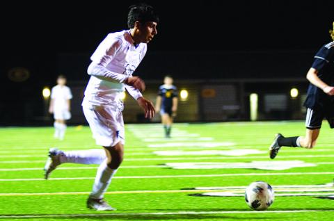 Jose Gomez dribbles in the box before getting a shot away against the Gatesville Hornets. HUNTER KING | DISPATCH RECORD