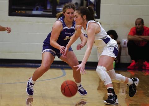 Kenna Davis plays tough defense on the Jarrell ball handler during Tuesday’s game. HUNTER KING | DISPATCH RECORD