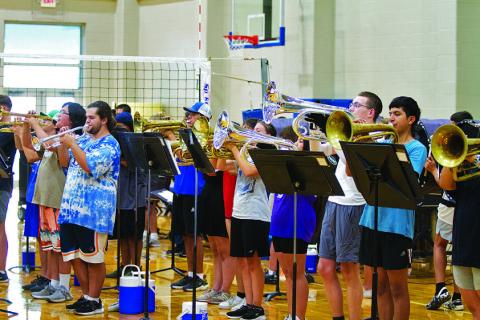 The brass section raises the roof at the final Lampasas High School Badger Band summer rehearsal on Monday evening. HUNTER KING | DISPATCH RECORD