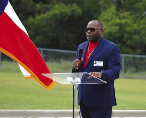 Retired Army veteran Terwan Crowley gives an address to Taylor Creek Elementary School students on the importance of first responders and U.S. military members. ERICK MITCHELL | DISPATCH RECORD
