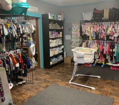New Beginning of Restoration and Hope distributes children’s clothing and supplies to support new families. COURTESY PHOTO
