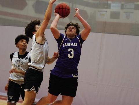 HUNTER KING | DISPATCH RECORD Aidan Nuckles shoots a contested shot over a Vandergrift defender during Wednesday’s action.