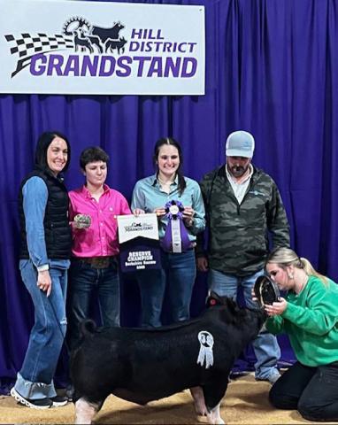 Lampasas FFA member Cole Rutland exhibited the reserve champion Berkshire barrow at the Hill District Grandstand Livestock Show in Kerrville. The pig made the sale and was scheduled to sell over the weekend in Fredericksburg. COURTESY PHOTO