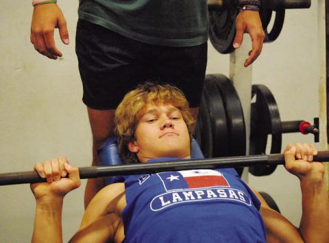 FILE PHOTO Haegan Oncken lifts weights during last summer’s SWAT workouts.