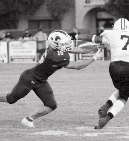 Case Brister reaches for a tackle in a Badger home game. JEFF LOWE | DISPATCH RECORD