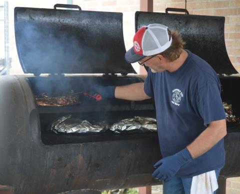 Kempner Volunteer Fire Department Capt. Todd Burkett ensures the brisket is cooked to the perfect temperature. Barbecue sandwiches and meal plates prepared by the KVFD volunteers were served Saturday as part of the department’s annual fundraiser. erick mitchell | dispatch record
