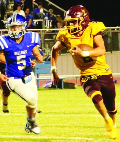 COURTESY PHOTO | MEGAN LUSTY Stone Carr-Jones looks for running room past a Bulldog defender. Carr-Jones finished with 161 yards and a touchdown in the Hornets’ win Friday night.