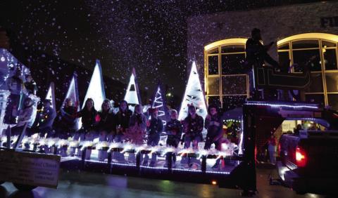 Spectators had a extra treat at this year’s Christmas parade as “snow” graced the sky on Saturday evening. JOYCESARAH MCCABE | DISPATCH RECORD
