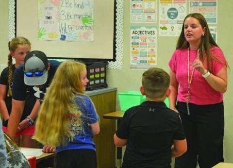 Hanna Springs Elementary School second-grade teacher Taylor Richard welcomes students to their new classroom. ERICK MITCHELL | DISPATCH RECORD