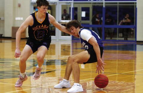 HUNTER KING | DISPATCH RECORD Ty Borchardt dribbles behind his back to evade a defender during last Friday’s tournament.