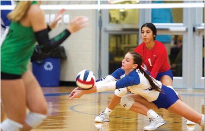 HUNTER KING | DISPATCH RECORD Landry White dives for a dig during the second set against Burnet.