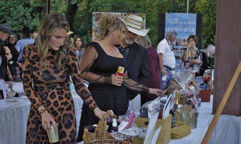 Boots and Blazers Ball attendees were busy eyeing silent aution items on display during Saturday’s event for the Lampasas Association for the Arts. ERICK MITCHELL | DISPATCH RECORD