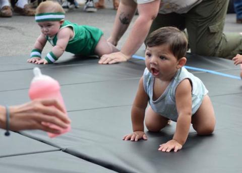 ALEXANDRIA RANDOLPH | DISPATCH RECORD Joseph Martin Hall eyes a toy at the finish line just before winning his race.