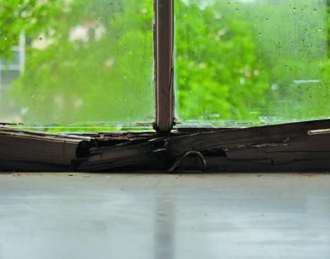 ERICK MITCHELL | DISPATCH DISPATCH A view from one of the windows in the upstairs courtroom shows rotten wood. This is just one of the many windows Lampasas County Judge Randy Hoyer has noticed in need of repairs. The Lampasas County Commisioners Court discussed courthouse renovations in a workshop on April 22.