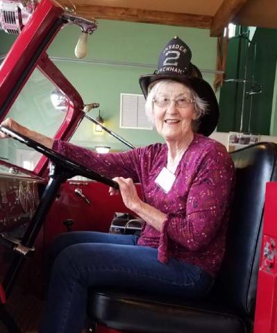 Nancy Kahlstrom of Lampasas, a Central Texas Travel Club member, is shown on a 1950 American LaFrance 750-gpm pumper known as “Invader” at Brenham Fire Department #1 while on a recent tour of Brenham and Chappell Hill. COURTESY PHOTO