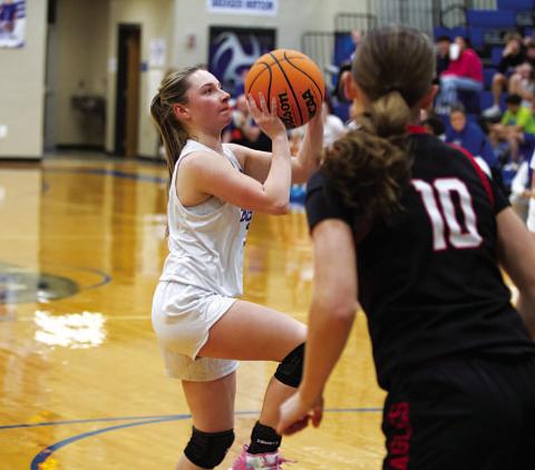 HUNTER KING | DISPATCH RECORD Abra White attempts a floater in the paint againt the Lady Eagles on Tuesday.