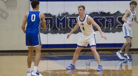 Quinn Pace plays defense on a Whitney guard during last Friday’s contest. Pace has scored in double digits in his last two games. HUNTER KING | DISPATCH RECORD