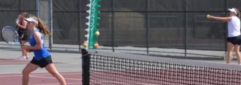 Abby Valdez plays the net while Kailr Clements serves during girls’ doubles at Brownwood on Thursday. KENNETH PEISER | COURTESY PHOTO