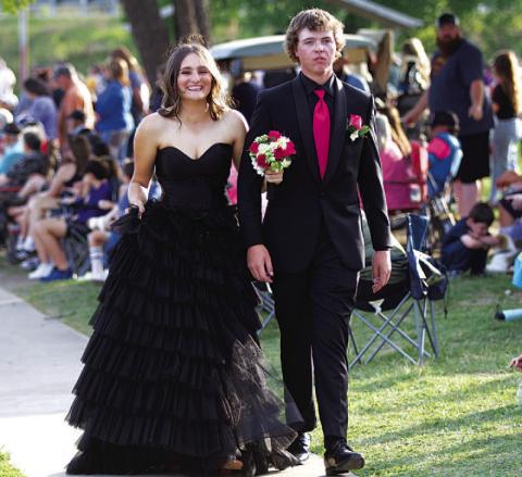 HUNTER KING | DISPATCH RECORD At left, Paige Rutland and Hagan Davis make their way to the W.M. Brook Park suspension bridge.