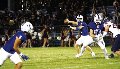 HUNTER KING | DISPATCH RECORD Reed Jerome prepares to throw a slant to Raider Morua during last week’s game against Wimberley.