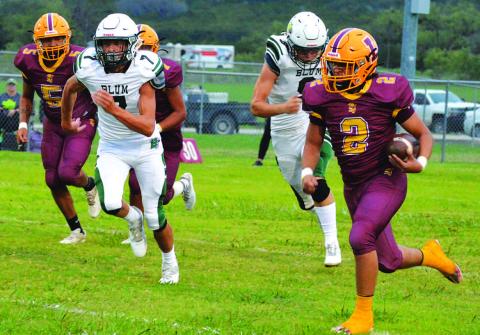 Elijah Gonzales (5) and Matthew Surber (4) are in on a tackle for loss. MASON HINES | DISPATCH RECORD