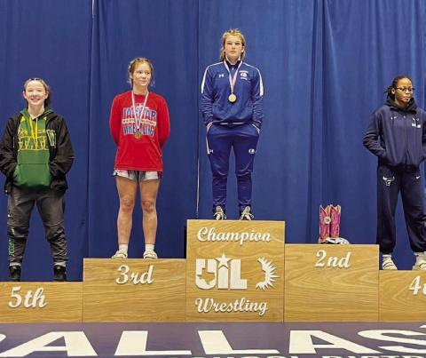 Taylor Martell stands atop the podium after winning the regional meet last week. HUNTER KING | DISPATCH RECORD