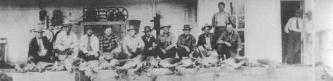 Deer hunters photographed at historic ice house