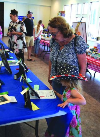 Community members of all ages enjoyed viewing Lampasas County Fair submissions at the First Presbyterian Church Fellowship Hall last summer. FILE PHOTO