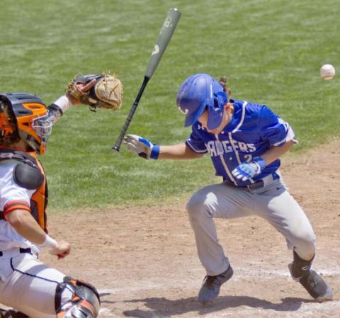 Elijah Stanley takes one for the team with a hit-by-pitch off the helmet that drove in a run in his last Badger baseball game. JEFF LOWE | DISPATCH RECORD