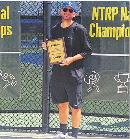 Eric White poses with his plaque from winning the national tennis tournament in Orlando. COURTESY PHOTO