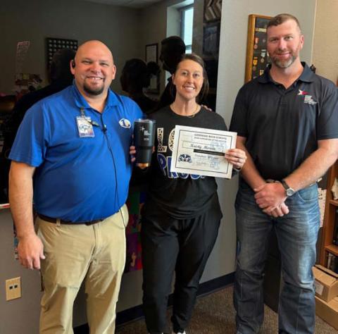 COURTESY PHOTO Kristy Morua was named the Support Staff of the Month at Lampasas High School. Assistant Principal Ryan Race, at left, said Morua is willing to step in and always has a smile on her face. “She is the ultimate team player,” he said. Also pictured is Clay Phillips of Texas Farm Bureau Insurance, who helped recognized Morua. Not pictured: Substitute of the Month Ann Bechtel.