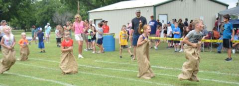 Kids hopped their way to the finish line in this year’s sack race during Kids’ Day last Friday. The event was part of the town’s Spring Ho festival. MONIQUE BRAND | DISPATCH RECORD