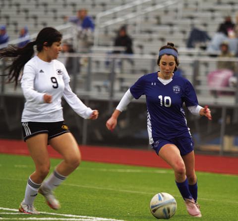 Liliana Fryer dribbles past a defender. As a freshman, she has been an important player this season. FILE PHOTO