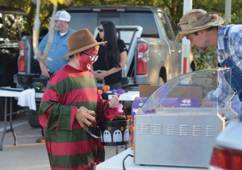 Freddy Kreuger stops by for a hot dog during the city of Kempner’s annual Trunk or Treat event at City Hall. erick mitchell | Dispatch record