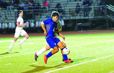 HUNTER KING | DISPATCH RECORD Juan Rodriguez fights with a Stephenville defender as he dribbles toward the goal.