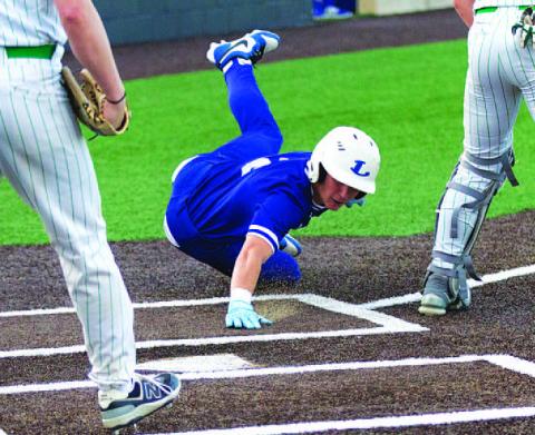 HUNTER KING | DISPATCH RECORD JT Posten slides into home plate to score the Badgers’ second run of the first inning against Burnet on Tuesday.