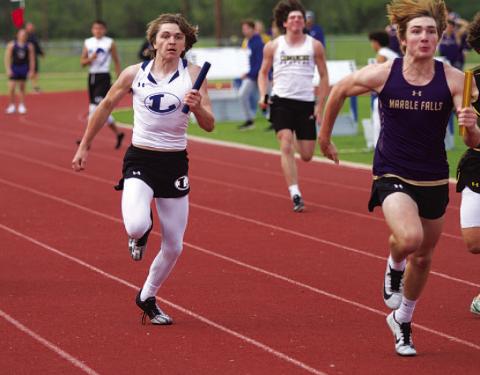 HUNTER KING | DISPATCH RECORD Jaden Phillips races down the final stretch of the boys’ 4x100-meter relay at last Wednesday’s meet.