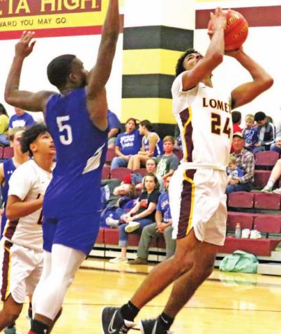 Dyllen Workmon goes up for a layup during the home tournament last week. JESSICA MALDONADO | DISPATCH RECORD